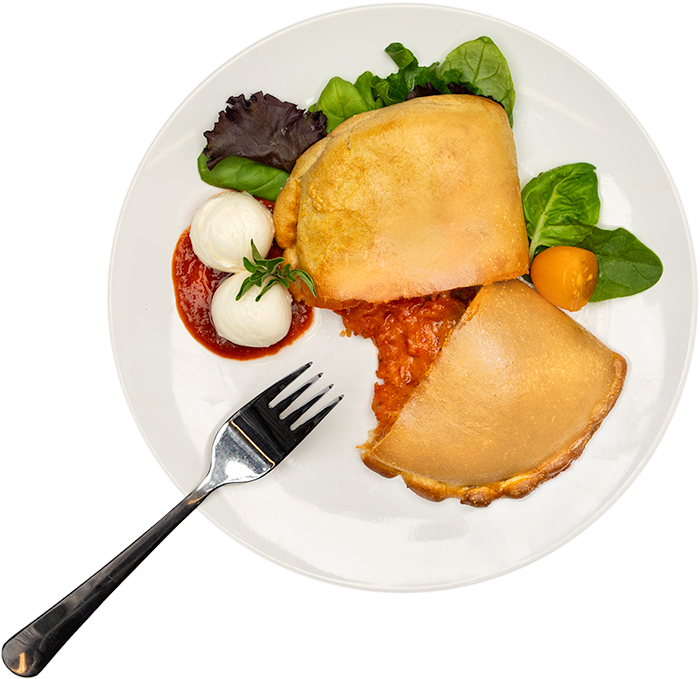 Image of the Pepperoni 5oz Pocket product on a plate, with other assorted foods