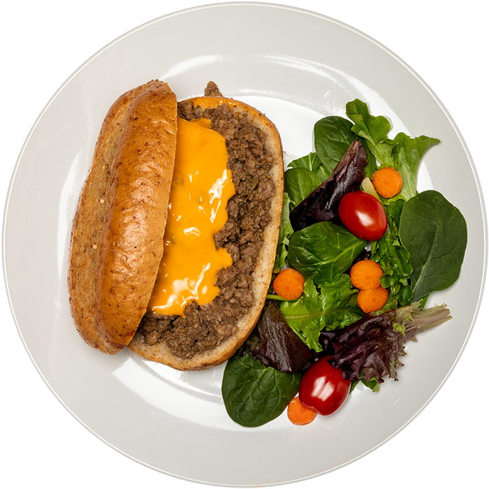 Image of the Unseasoned Beef Crumble product on a plate, with other assorted foods