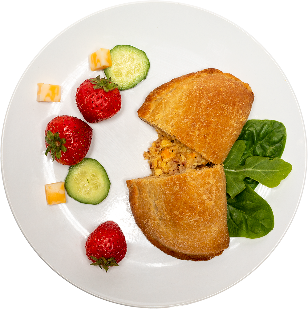 Image of the Bacon Biscuit Pocket product on a plate, with other assorted foods